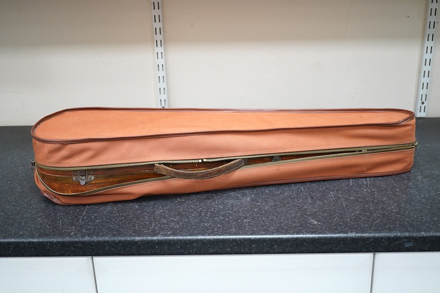 A cased violin, possibly German, body 35.5cm, in a good wooden case with canvas outer cover. Condition - fair